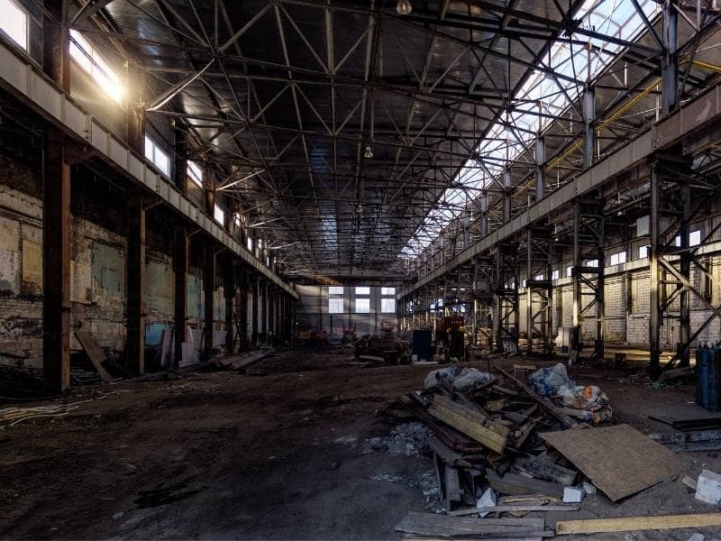 Interior of an abandoned commercial building illustrating a property evaluated with an ALTA Survey before redevelopment, renovation, or commercial investment.